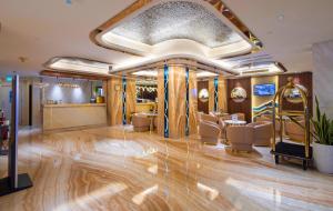 a dressing room with a hair salon with chairs at Winsuites Saigon Hotel in Ho Chi Minh City