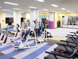 a gym with treadmills and elliptical machines at The Crown Palais New Hankyu Kochi in Kochi