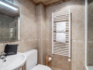 a bathroom with a toilet and a sink and a mirror at Chalet indépendant avec sauna et parking à Courchevel 1650 - 8 pers - FR-1-563-162 in Courchevel