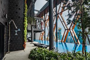 a view from the top of a building with a pool at Luxury Scarletz Suites KLCC in Kuala Lumpur
