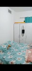 Una cama o camas en una habitación de Biggest Room in Sharjah