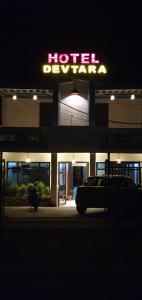 a hotel doorway with a car parked in front of it at Devtara- Himalayan Hotel in Bhairahawa