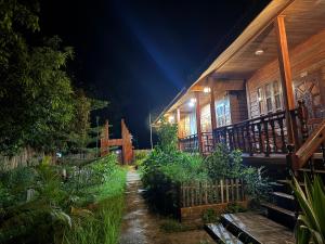 a house at night with a garden in front of it at Letana Guesthouse in Ban O