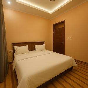 Ένα ή περισσότερα κρεβάτια σε δωμάτιο στο Amada Kigali Luxury Apartments