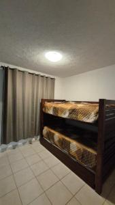a room with two bunk beds in it at Marina Diamante Victory in Acapulco