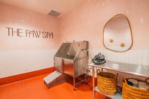 a dressing room with a sink and a mirror at Vibrant City Stay 2BR High Rise with Pool & Gym in Phoenix