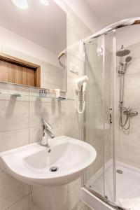 Et badeværelse på Zulian Aparthotel by Artery Hotels
