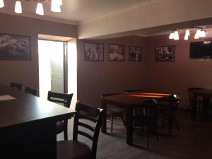 a dining room with a table and chairs and a window at Guest house Ak Keme in Bosteri
