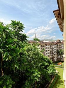 a view of a apartment complex from a balcony at 2BR Condo w Pool & WiFi Near Mall & Restaurants in Lapasan