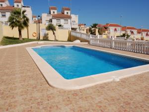 een zwembad voor een huis bij Sunny Stay, Orihuela Costa in Villamartin