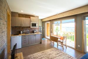 a kitchen and dining room with a table and chairs at Garden House in Porto