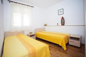 Ein Bett oder Betten in einem Zimmer der Unterkunft Apartment Sangaleti