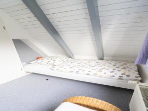 a bunk bed in a room with a ceiling at Ferienhaus in Bestwig mit privatem Garten in Bestwig +32 photos