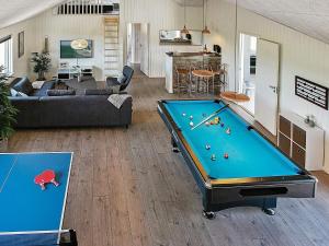 a living room with a pool table in it at 5 star holiday home in Stege in Stege +40 photos