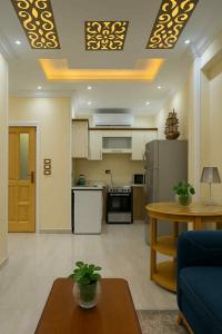 a room with a kitchen and a living room at Oscar Apartment ! 3 ! in Luxor