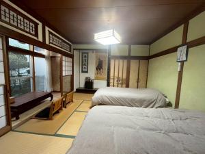 a bedroom with two beds and a window at komorebi - Vacation STAY 19085 in Hakodate