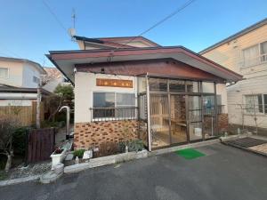 a small house with a lot of glass doors at komorebi - Vacation STAY 19085 in Hakodate