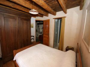 a bedroom with a white bed in a room at Holiday home in stunning location in Théminettes +32 photos