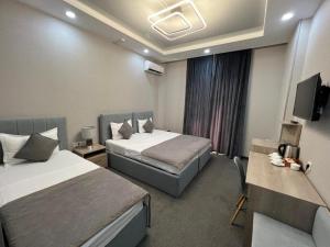 Katil atau katil-katil dalam bilik di Mini--Hotel Tashkent
