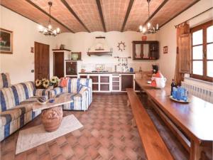 a living room with a couch and a table at Villa in Montalbano with Scenic Views in Città di Castello