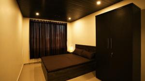 a living room with a couch and a window at The Solvista Villa 2hrs from Mumbai in Pali +79 photos