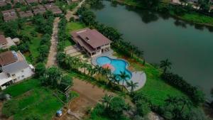an aerial view of a house with a swimming pool at The Solvista Villa 2hrs from Mumbai in Pali
