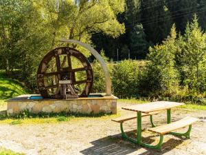a picnic table and a monument in a park at Apartment near Rennsteig in Goldisthal