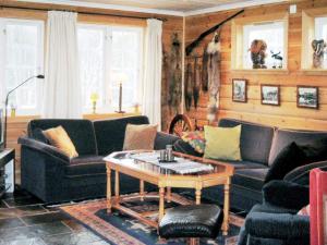 a living room with couches and a coffee table at 10 person holiday home in HOVDEN-By Traum in Hovden