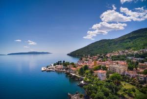 an aerial view of a small town on a lake at Apartments Belvedere - by Liburnia Hotels & Villas in Lovran