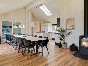 a large dining room with a table and chairs at 5 star holiday home in Bogense in Bogense
