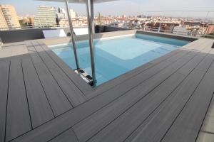 a swimming pool on the roof of a building at Barceló Valencia in Valencia