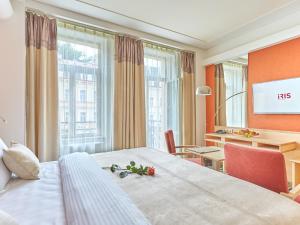 Llit o llits en una habitació de Spa Hotel Iris