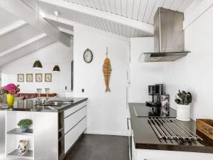 a kitchen with a sink and a counter top at 4 star holiday home in Hjørring in Kærsgård Strand