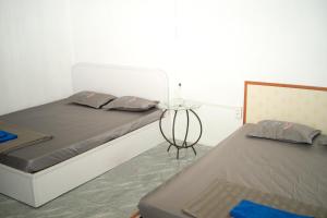 Postel nebo postele na pokoji v ubytování Nhà nghỉ bình dân Nguyen Quang