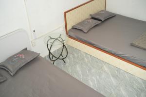 Postel nebo postele na pokoji v ubytování Nhà nghỉ bình dân Nguyen Quang