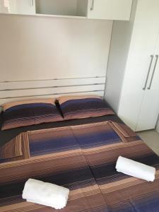 a bedroom with two beds in a room at Apartments Villa Jennifer in Orebić