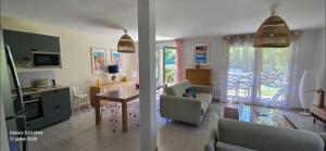 a living room with a kitchen and a dining room at New house with all comforts in Grimaud in Grimaud