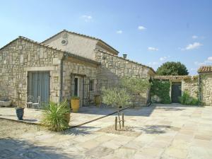 a stone building with a courtyard in front of it at Vineyard Villa in Montfrin in Montfrin +33 photos