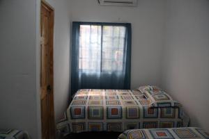 Katil atau katil-katil dalam bilik di Hostal Mi Castillo