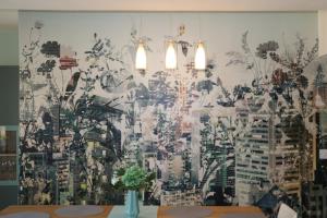 a room with a wall with a painting on it at Stunning Clifton flat in amazing central location in Bristol