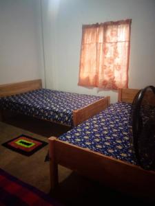 Ένα ή περισσότερα κρεβάτια σε δωμάτιο στο Dewmihi guest house