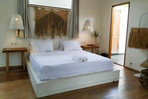 Postel nebo postele na pokoji v ubytování Villa Ubuntu 3BR Pool Ricefield Family&Friends group near Canggu + 9 fotografií