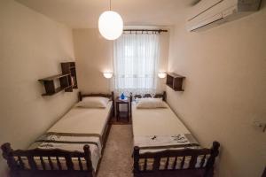 Postel nebo postele na pokoji v ubytování Apartments Tonšić