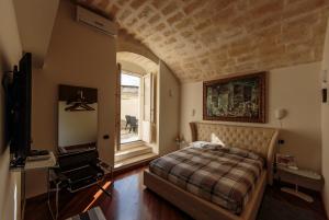 Postel nebo postele na pokoji v ubytování Alla dimora di Chiara Suite and Rooms