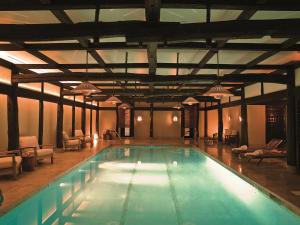 a large swimming pool in a large building at The Greenwich Hotel in New York
