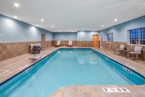 a large swimming pool in a hotel room at Holiday Inn Express Hotel & Suites Defiance by IHG in Defiance