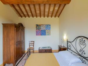 a bedroom with a bed and a wooden ceiling at Getaway in the Sibillini Hills in Monte San Martino