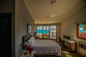 Postel nebo postele na pokoji v ubytování Hotel Volcano