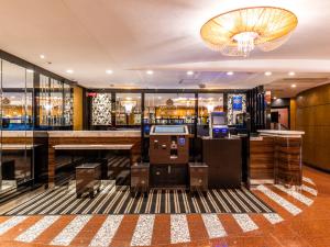 a bar in a hotel room with a lobby at APA Hotel Kyoto Ekimae in Kyoto