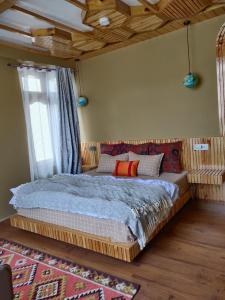 Ένα ή περισσότερα κρεβάτια σε δωμάτιο στο Raangyul Homestay